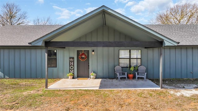 back of house with a porch and a yard