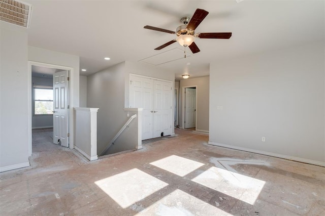 unfurnished room with ceiling fan