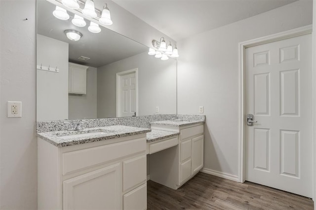 bathroom featuring hardwood / wood-style floors and vanity