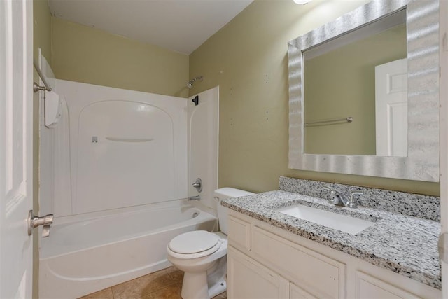 full bathroom with toilet, tile patterned flooring, vanity, and washtub / shower combination