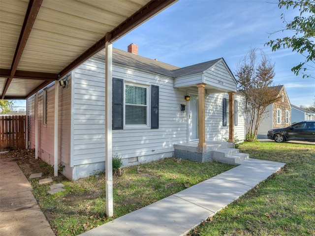 bungalow-style home featuring a front yard