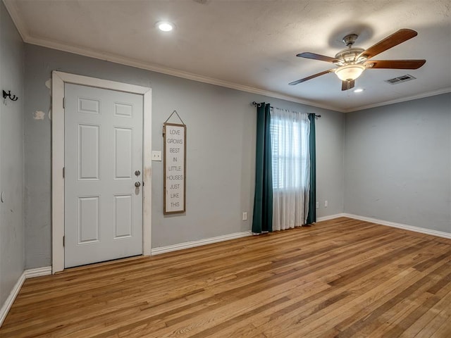 entryway featuring ceiling fan, light hardwood / wood-style floors, and crown molding