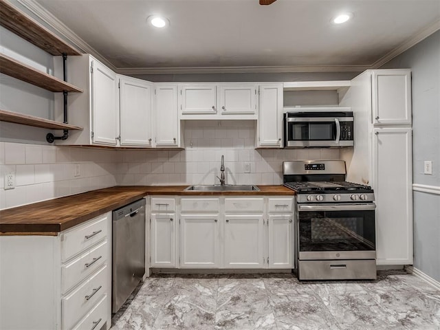 kitchen with sink, white cabinets, and stainless steel appliances