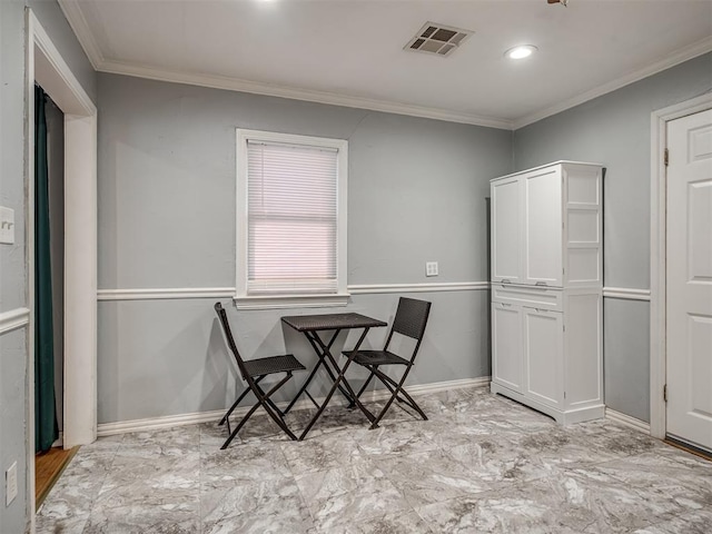 dining space featuring ornamental molding