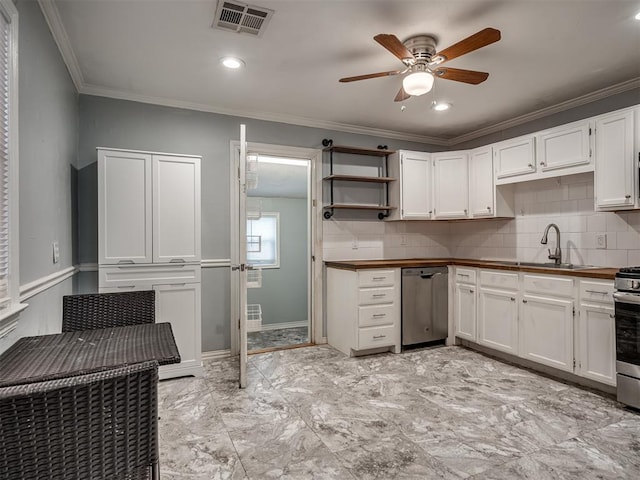 kitchen with ceiling fan, sink, crown molding, white cabinets, and appliances with stainless steel finishes