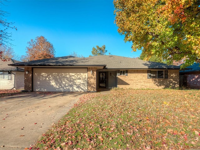 ranch-style home featuring a garage