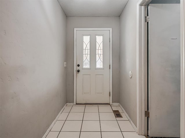 entryway with light tile patterned floors