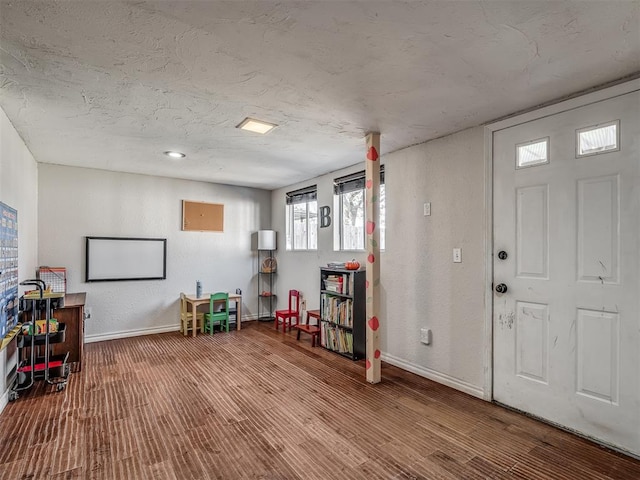 entryway with a textured ceiling