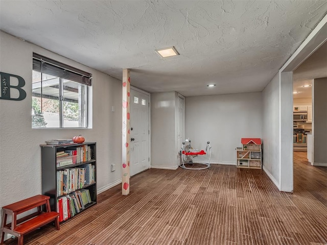 interior space featuring carpet and a textured ceiling