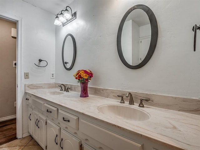 bathroom with tile patterned flooring and vanity