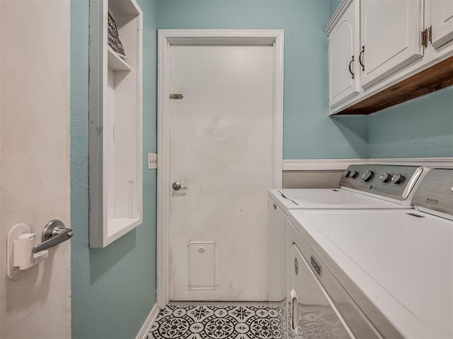 laundry area with cabinets, independent washer and dryer, and light tile patterned floors