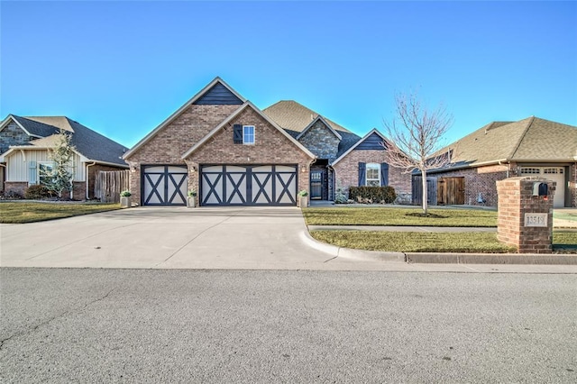 view of front of house featuring a garage and a front yard