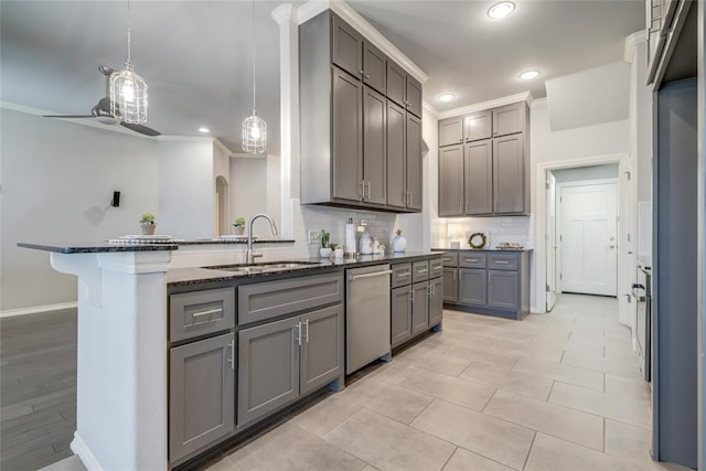 kitchen with gray cabinets, an island with sink, dishwasher, sink, and hanging light fixtures