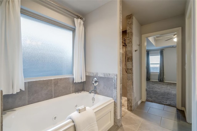 bathroom with independent shower and bath and tile patterned floors