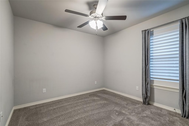 spare room featuring carpet floors and ceiling fan