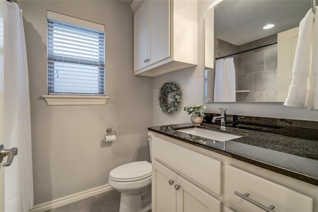 bathroom with tile patterned floors, toilet, and vanity