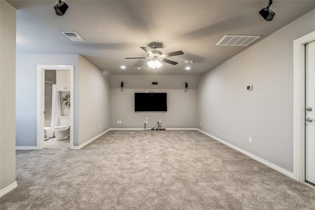 unfurnished living room with ceiling fan, carpet flooring, and vaulted ceiling