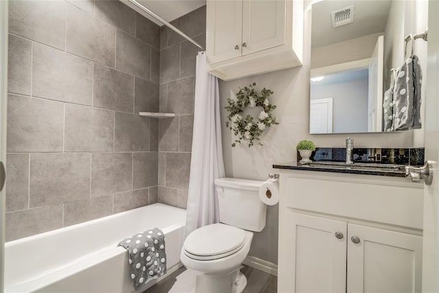 full bathroom with vanity, toilet, and shower / bath combo with shower curtain