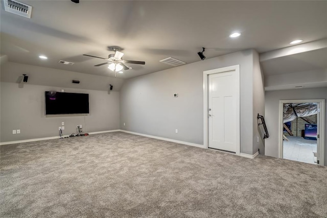 unfurnished living room featuring carpet floors and ceiling fan