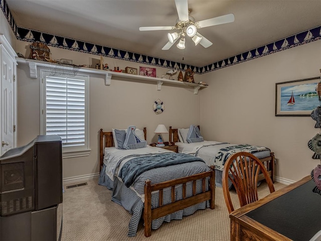 carpeted bedroom featuring ceiling fan