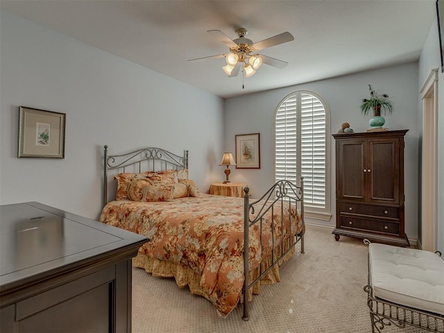 bedroom with light colored carpet and ceiling fan