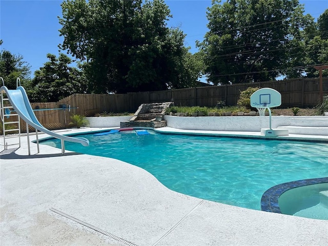 view of pool featuring a water slide