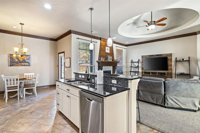 kitchen with white cabinetry, hanging light fixtures, stainless steel dishwasher, and sink