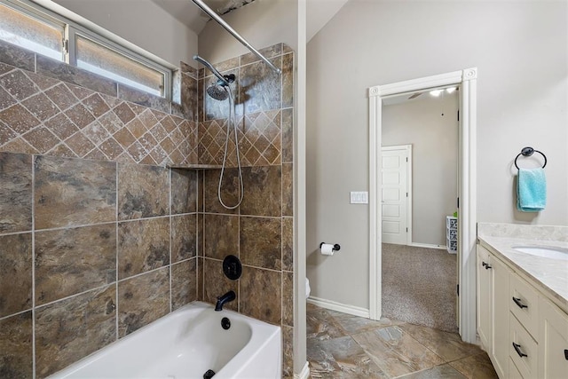 full bathroom featuring vanity, toilet, and tiled shower / bath