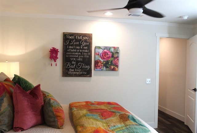 bedroom with ceiling fan, dark hardwood / wood-style flooring, and crown molding