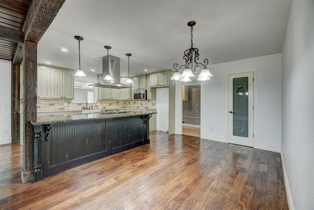 kitchen featuring stone counters, decorative backsplash, pendant lighting, light hardwood / wood-style floors, and island range hood