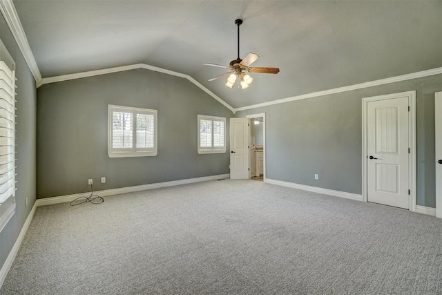 interior space featuring light carpet, vaulted ceiling, and ornamental molding