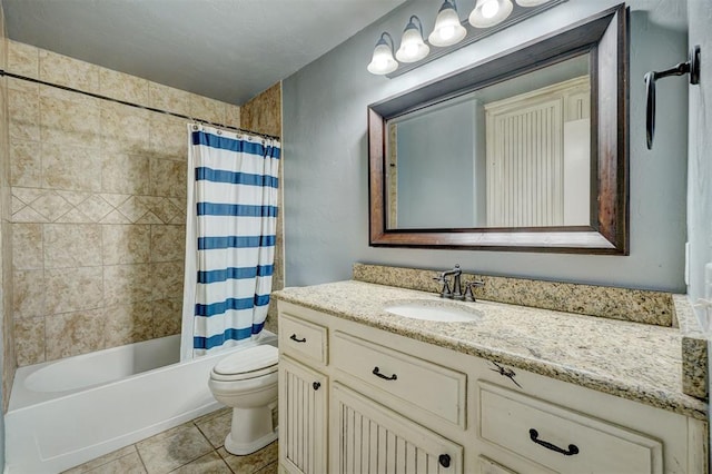 full bathroom with tile patterned floors, vanity, toilet, and shower / bath combo with shower curtain