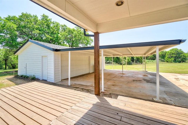 wooden terrace with a patio area