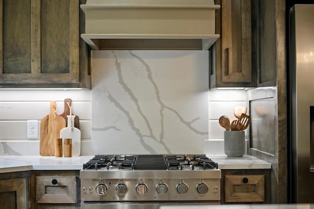 kitchen featuring dark brown cabinets and stainless steel appliances