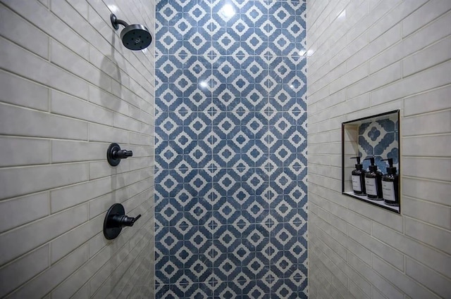 bathroom with tiled shower