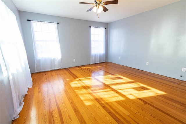 unfurnished room featuring light hardwood / wood-style flooring and ceiling fan