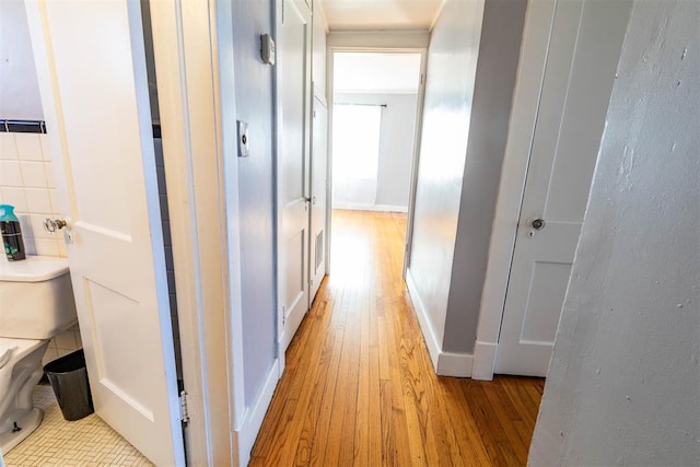 hall with light hardwood / wood-style floors