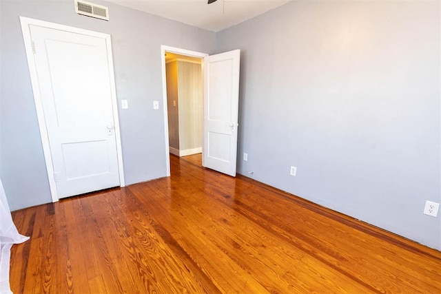 unfurnished bedroom featuring hardwood / wood-style floors