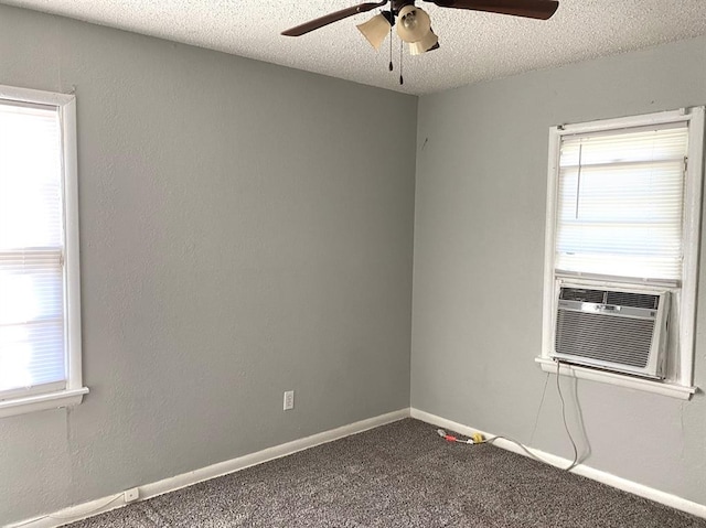 spare room with cooling unit, ceiling fan, carpet, and a textured ceiling