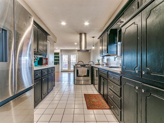 kitchen featuring pendant lighting, sink, light tile patterned floors, island exhaust hood, and stainless steel appliances