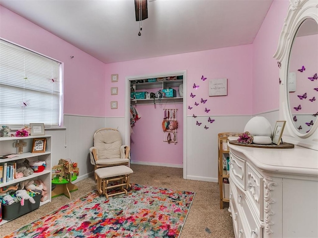 bedroom with ceiling fan and a closet