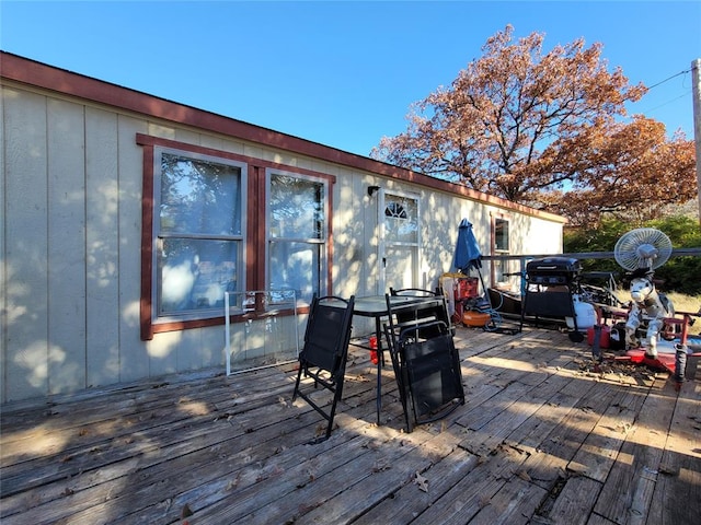 wooden deck with area for grilling