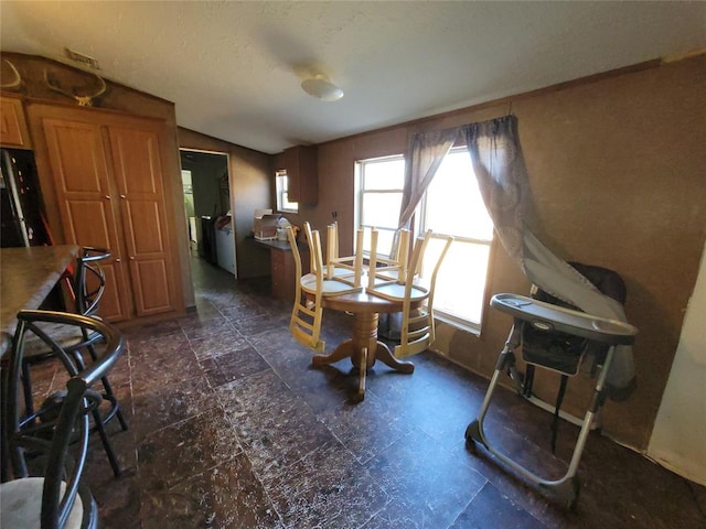 dining area with lofted ceiling