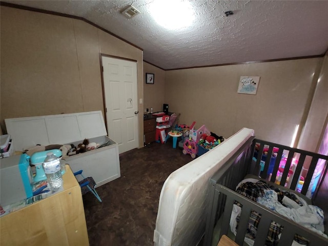 bedroom featuring dark colored carpet, lofted ceiling, and a textured ceiling