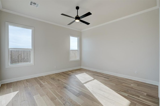 unfurnished room with light hardwood / wood-style floors, ceiling fan, and crown molding