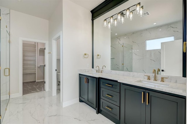 bathroom featuring vanity, toilet, and an enclosed shower