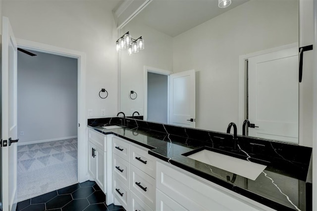 bathroom with tile patterned floors and vanity