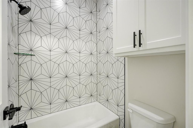 bathroom featuring toilet and bathing tub / shower combination