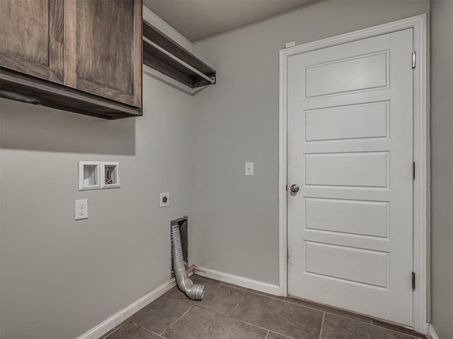 clothes washing area with hookup for an electric dryer, tile patterned flooring, cabinets, and washer hookup