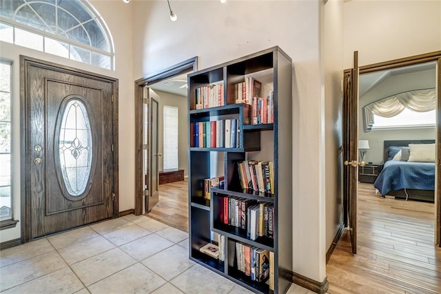 foyer entrance with light hardwood / wood-style flooring